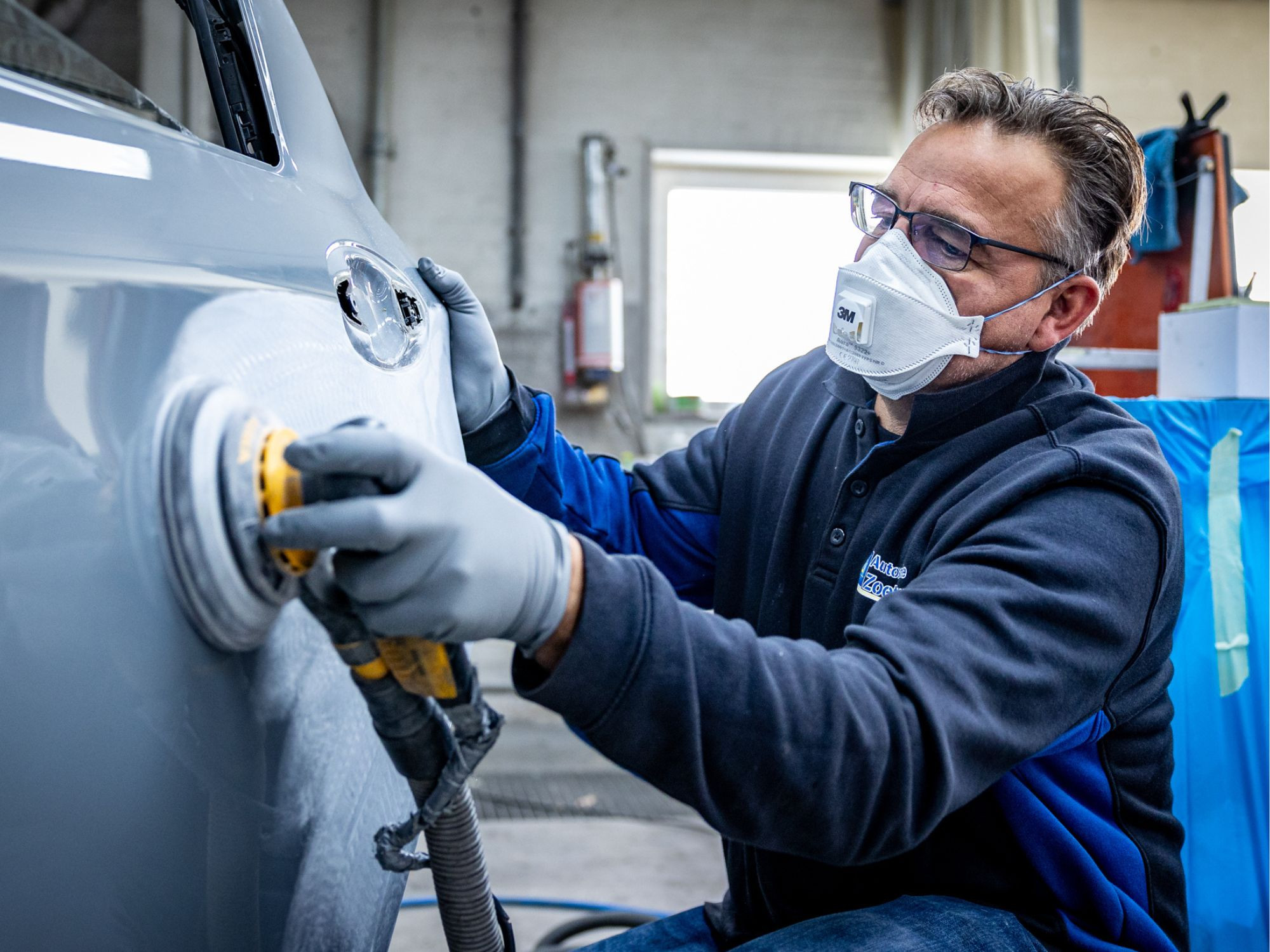 Vehicle being worked on in a garage
